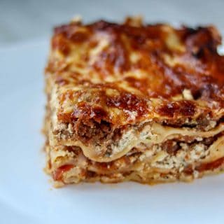 a slice of lasagna on a white plate