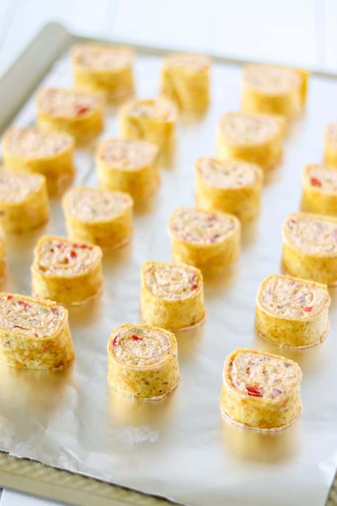 antojitos are rolled, cut, and placed on a baking sheet