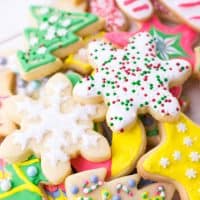 a pile of decorated sugar cookies