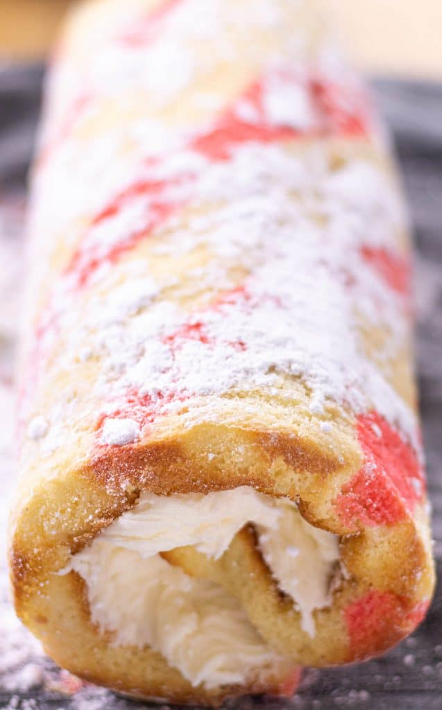 vanilla roll cake rolled up and ready to chill in the refrigerator overnight