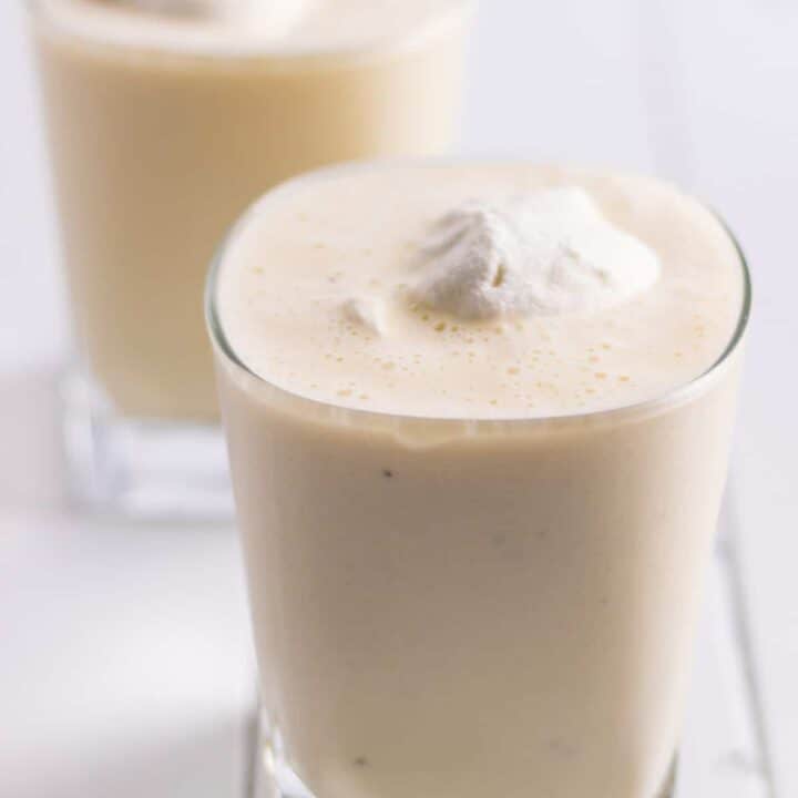 rum and eggnog milkshakes served with a dollop of nutmeg whipped cream on top