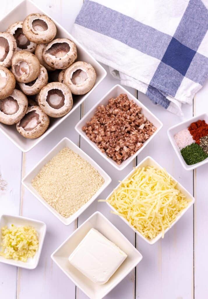 all of the ingredients to make cheesy stuffed mushrooms