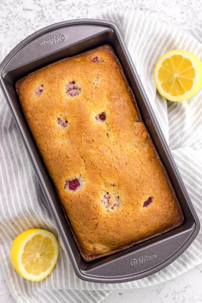 raspberry lemon loaf in the loaf pan after it has been baked