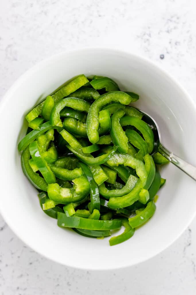 prepared pickled jalapenos in a white bowl
