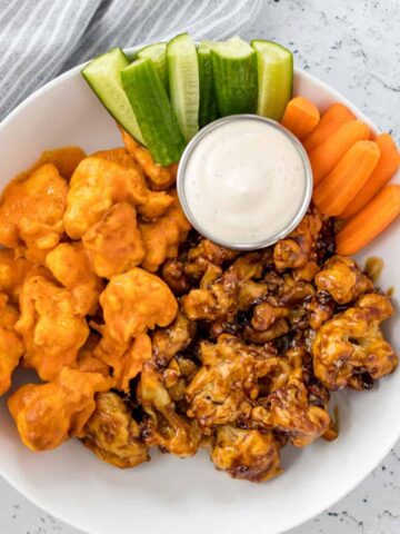 air fryer cauliflower wings served with veggies and a side of ranch dipping sauce