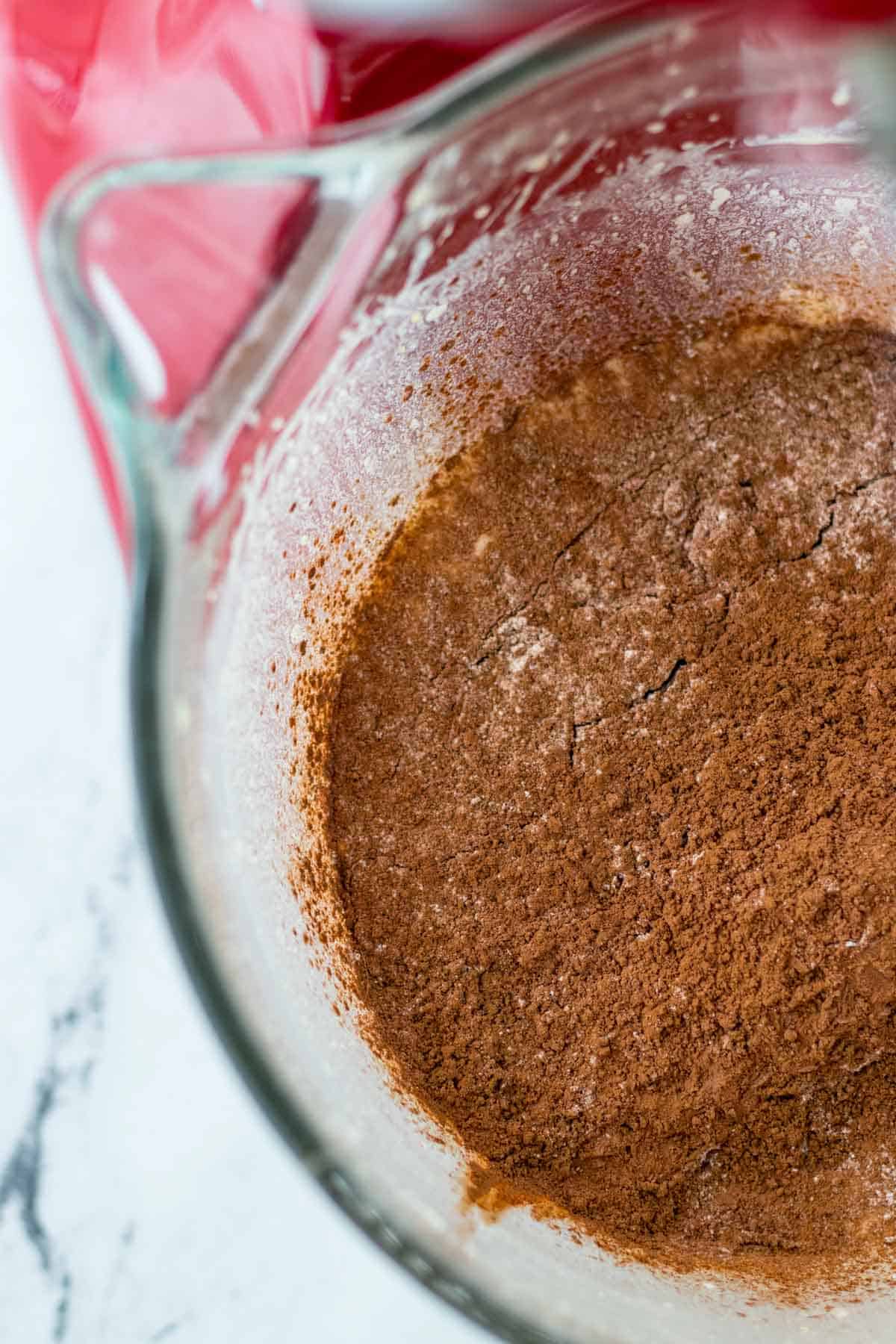 Adding the dry ingredients to the wet ingredients.