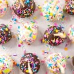 Easy homemade cake pops decorated with colourful sprinkles.