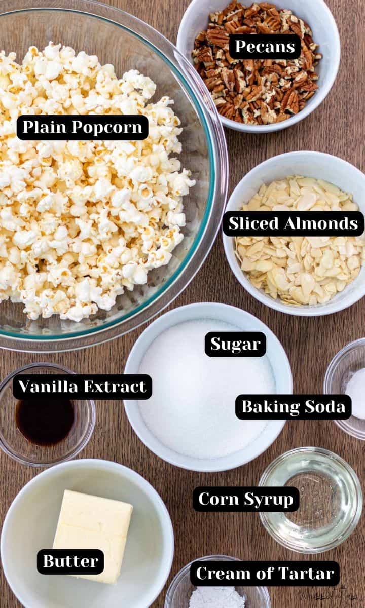Ingredients include; plain popped popcorn, pecans, sliced almonds, vanilla extract, sugar, baking soda, corn syrup, cream of tartar, and butter.