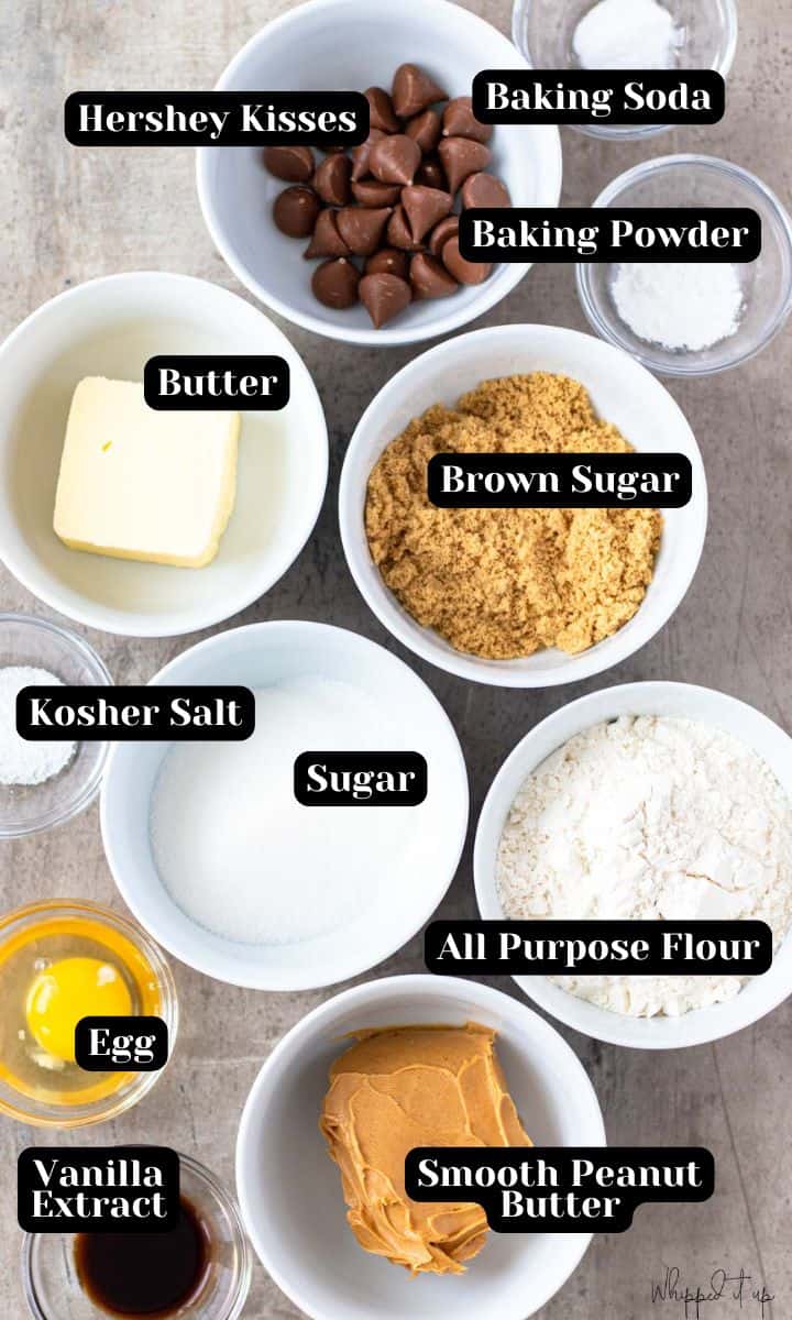 Ingredients include; Hershey kisses, baking soda, baking powder, butter, brown sugar, kosher salt, sugar, all purpose flour, egg, smooth peanut butter, and vanilla extract.