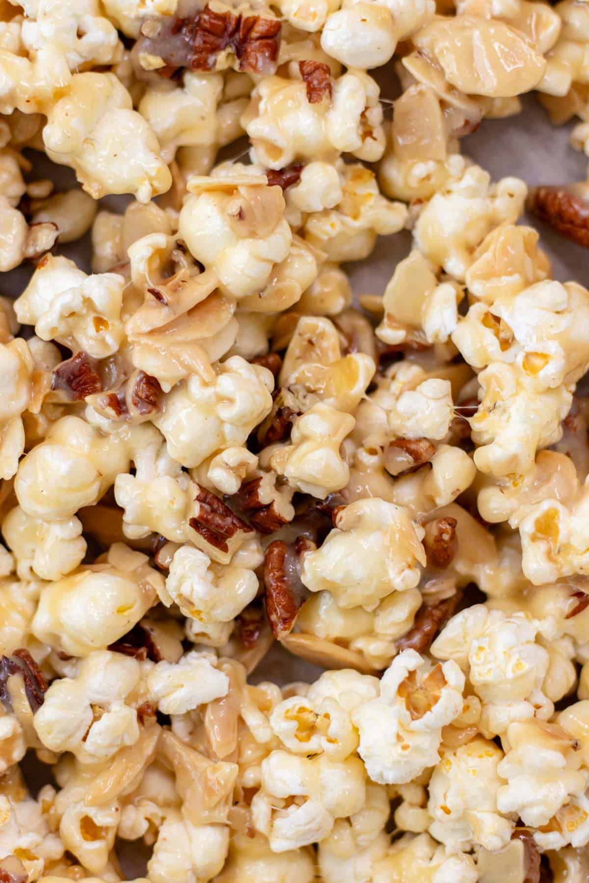 Sticky caramel popcorn with pecans and almonds.