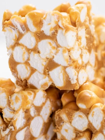 A stack of peanut butter marshmallow squares cut into bars.