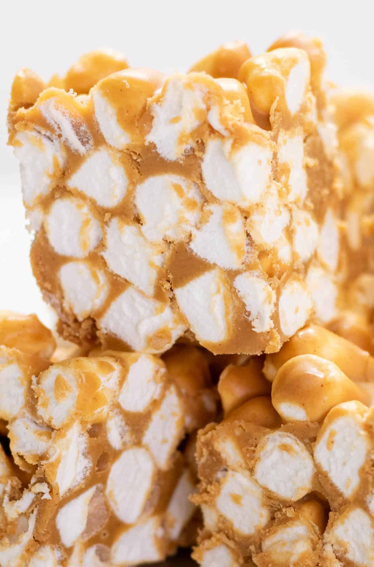 A stack of peanut butter marshmallow squares cut into bars.