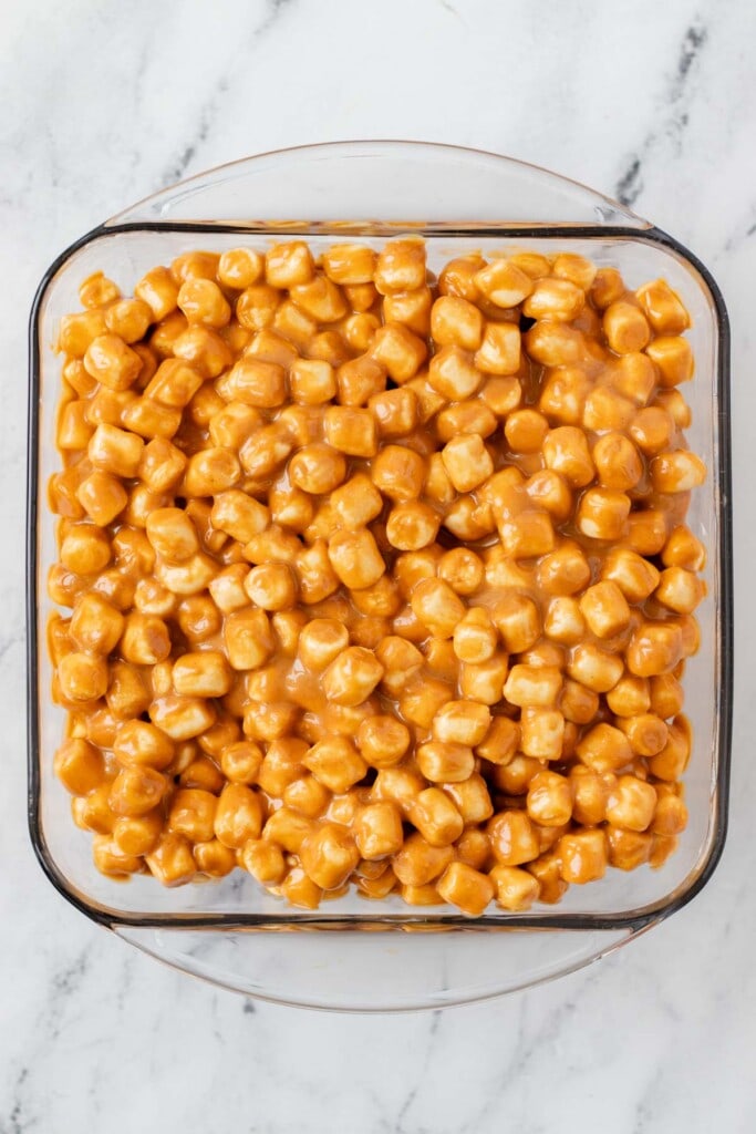 Peanut butter marshmallow squares in a baking dish.