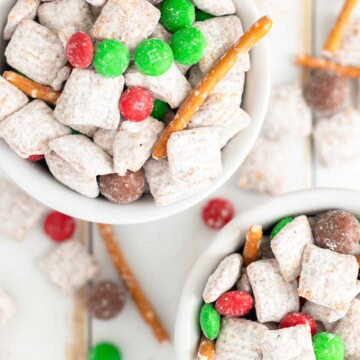 Christmas puppy chow piled in white ramekins.