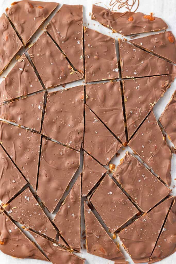 Breaking apart the milk chocolate almond bark.