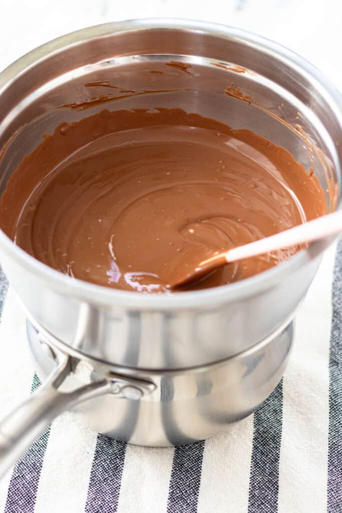 Melting the chocolate in a double broiler.