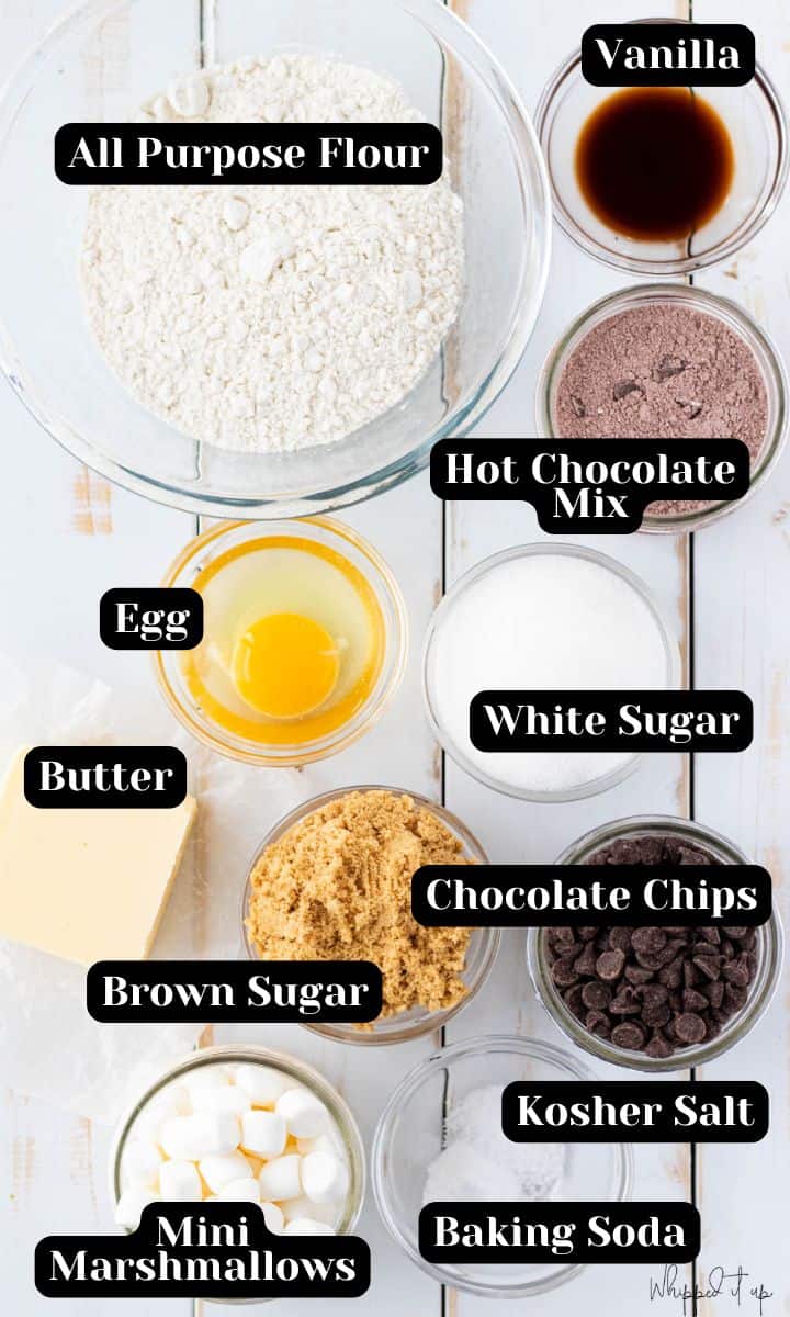Ingredients include all purpose flour, vanilla, hot chocolate mix, egg, white sugar, brown sugar, butter, chocolate chips, kosher salt, baking soda and mini marshmallows for topping.