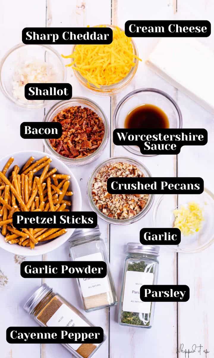 Ingredients include cheddar, cream cheese, shallot, bacon, Worcestershire sauce, crushed pecans, pretzel sticks, garlic, garlic powder, parsley, and cayenne pepper.