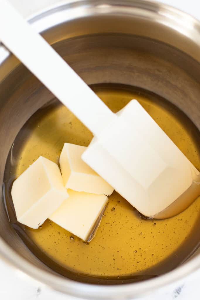 Melting the honey and butter in a saucepan.