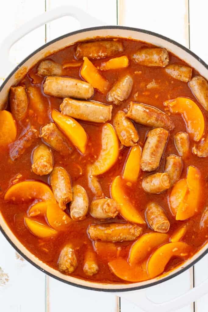 Sweet and sour sauce mixed with the browned sausages.