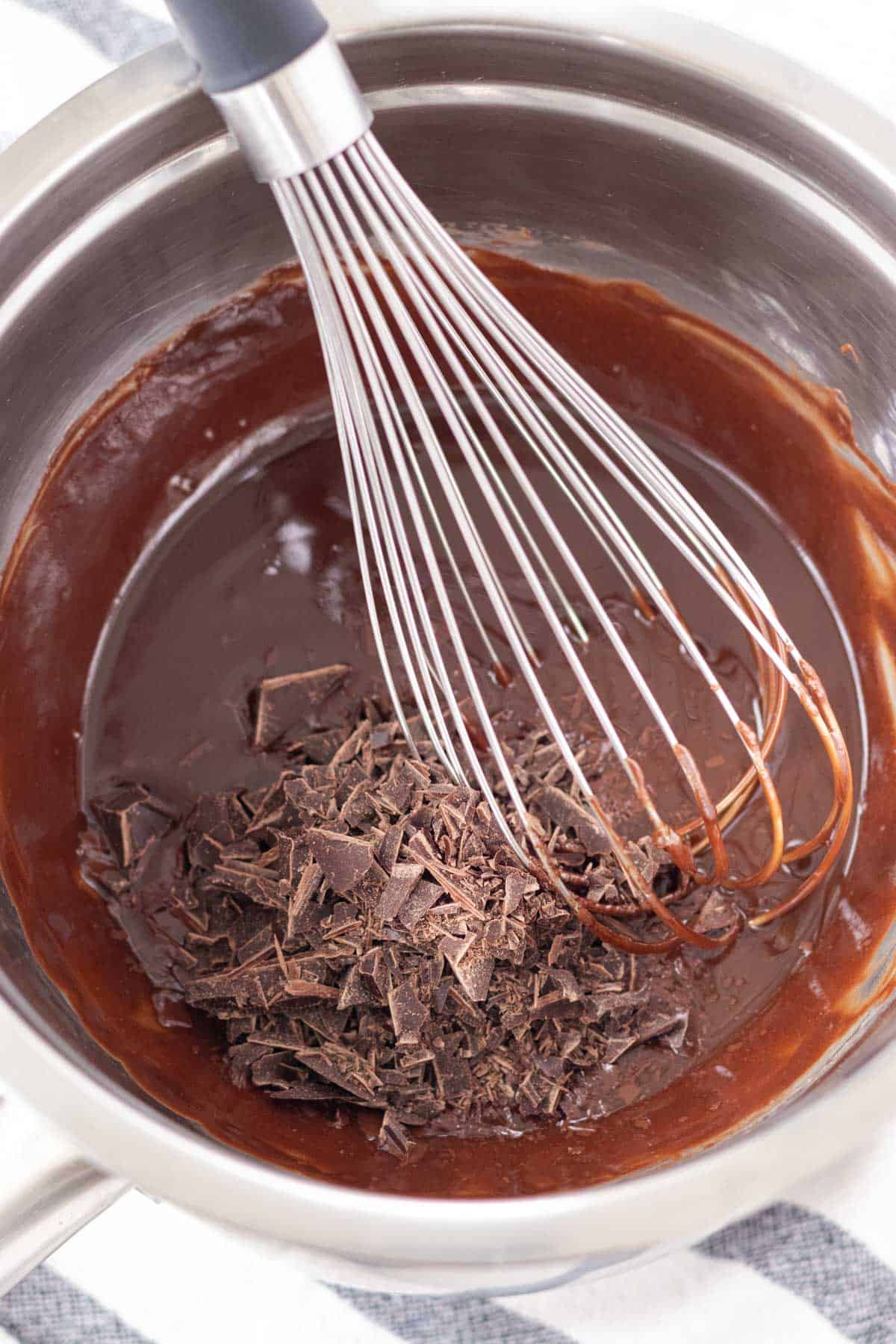 Making the chocolate ganache in a double broiler with a whisk.
