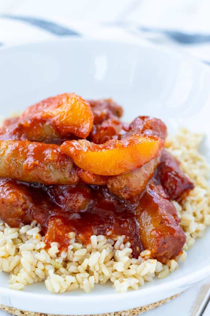 Sweet and sour sausages served over brown rice.
