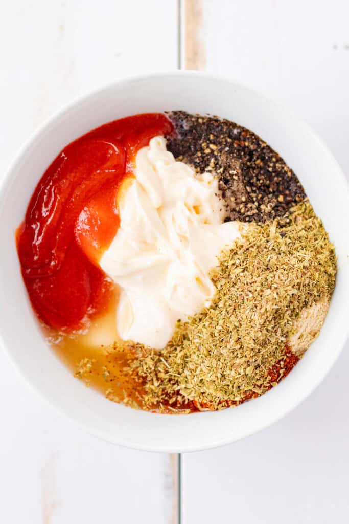 All of the ingredients in a white mixing bowl.