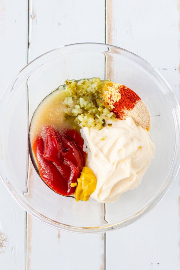 All the big mac sauce ingredients in a clear mixing bowl.