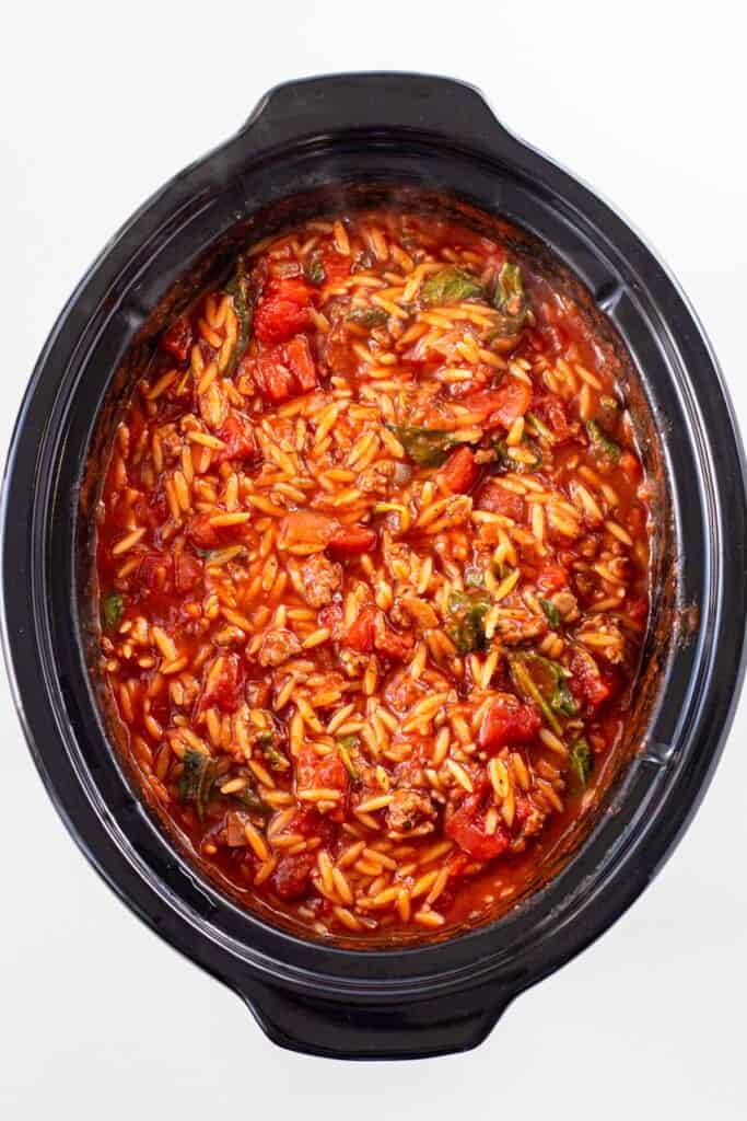 A slow cooker bowl filled with lasagna soup.