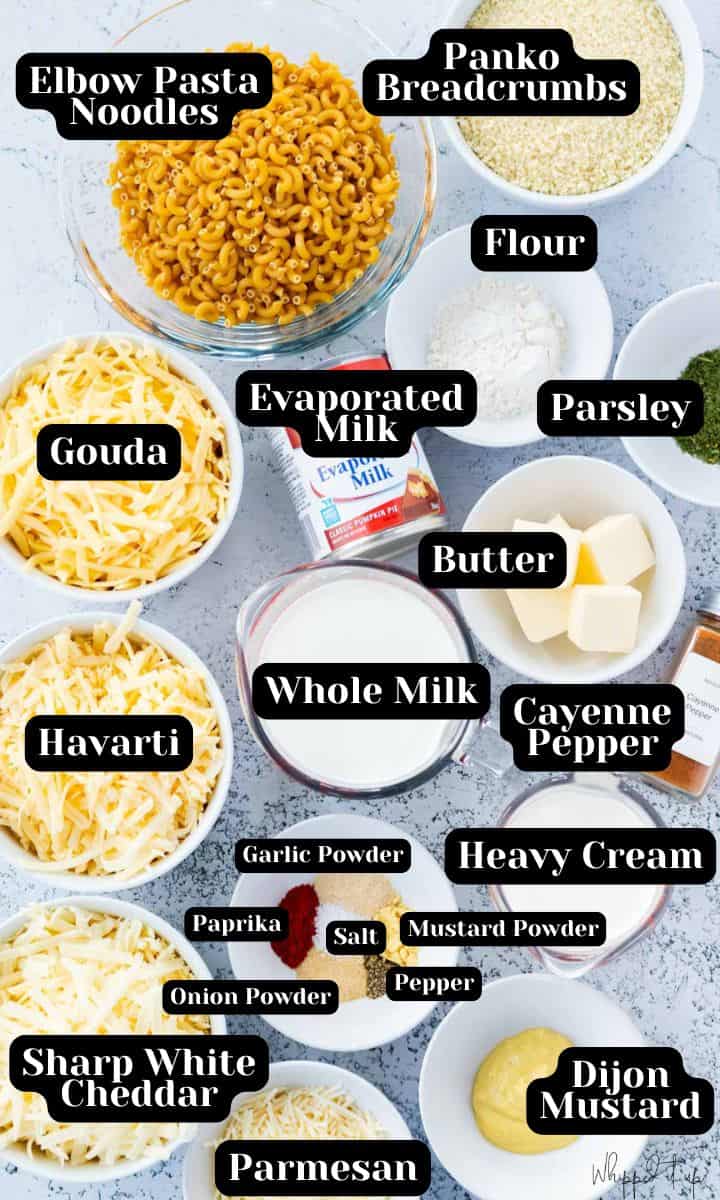 Ingredients include elbow noodles, panko, flour, parsley, butter, evaporated milk, gouda cheese, havarti cheese, sharp white cheddar, parmesan, whole milk, heavy cream, dijon mustard, garlic powder, paprika, onion powder, salt, pepper, mustard powder and cayenne pepper (optional).