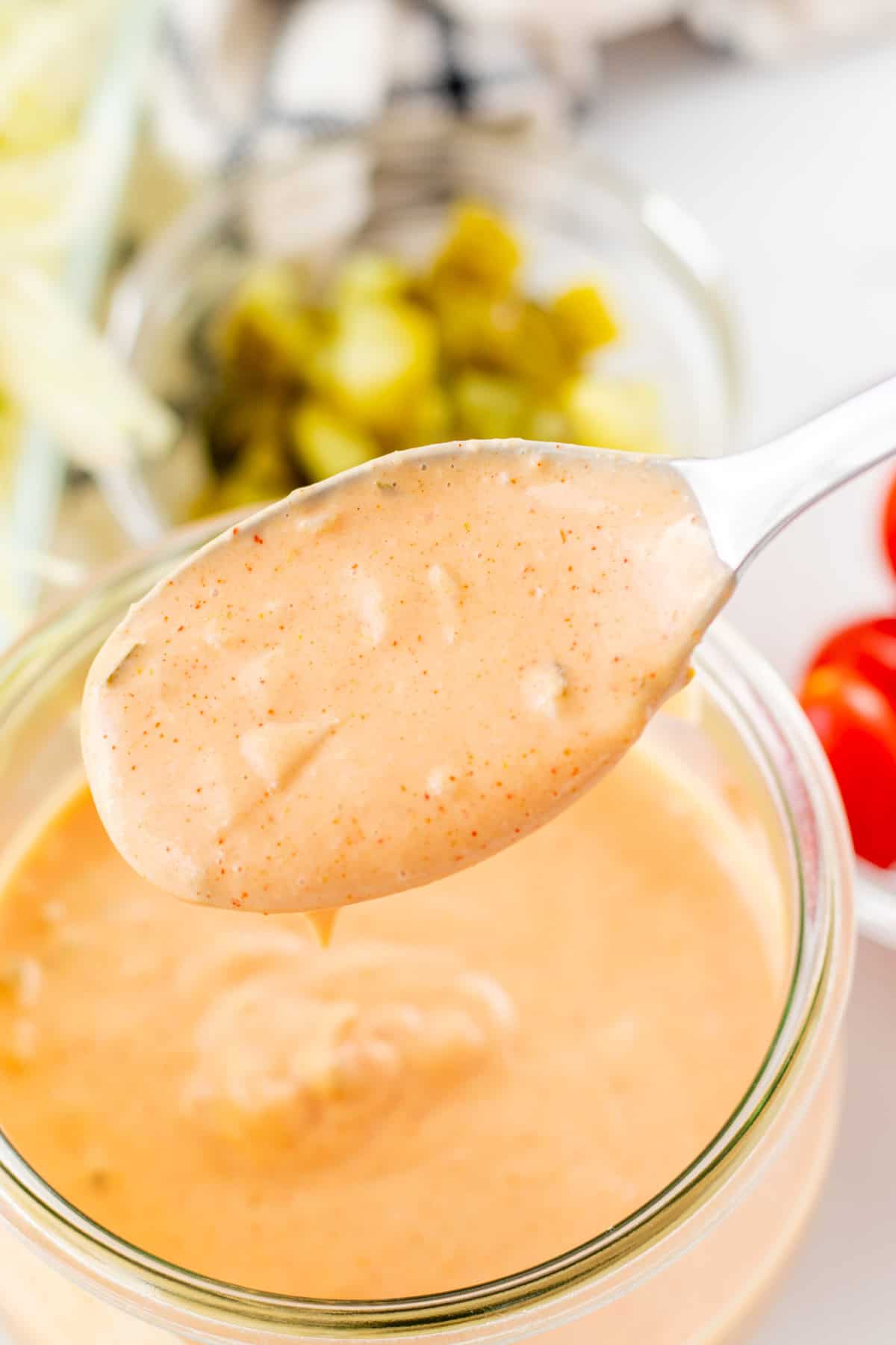 A scoop of big mac sauce on a spoon.