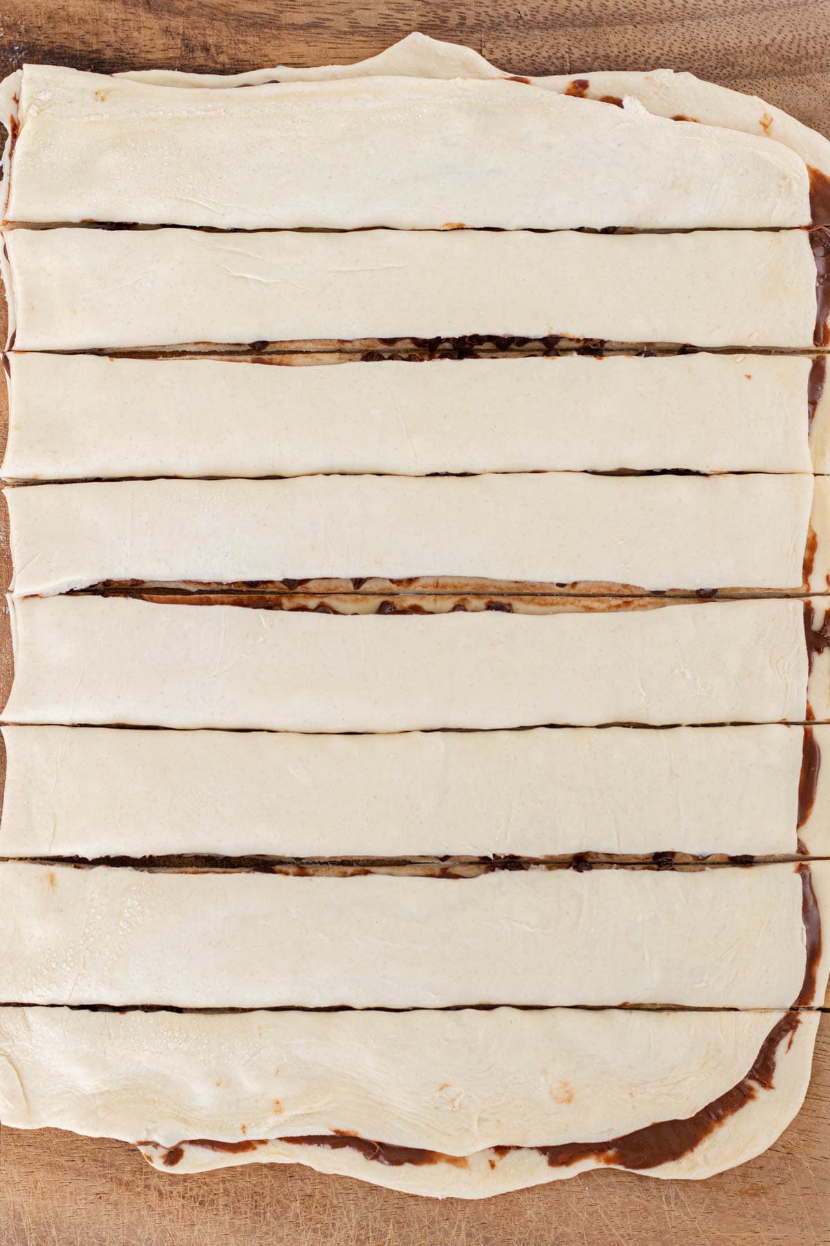Chocolate topped with the second piece of puff pastry and cut into strips.