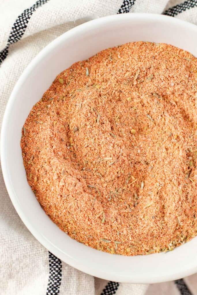 Cajun spice mix in a white bowl.