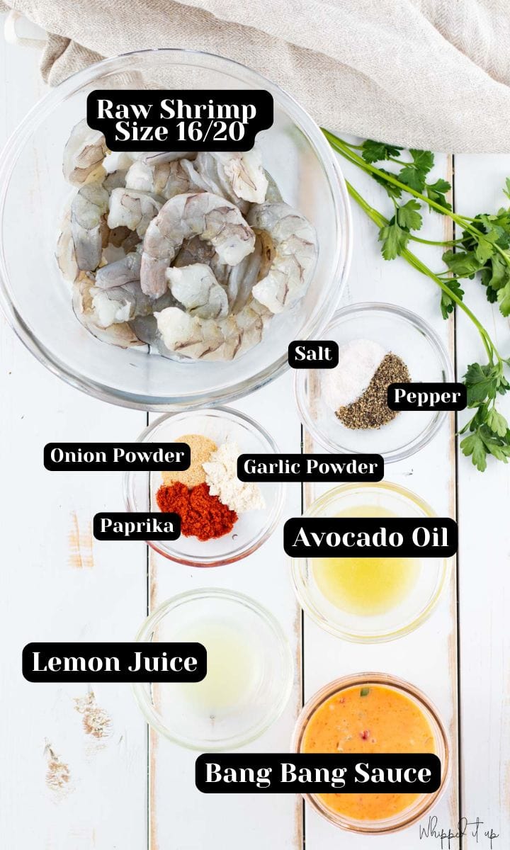 Ingredients include raw shrimp, salt, pepper, onion powder, garlic powder, paprika, avocado oil, lemon juice and bang bang sauce.