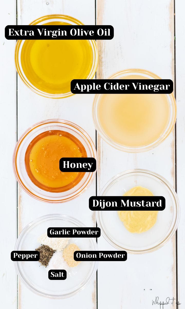Ingredients include extra virgin olive oil, apple cider vinegar, honey, dijon mustard, garlic powder, onion powder, salt and pepper.