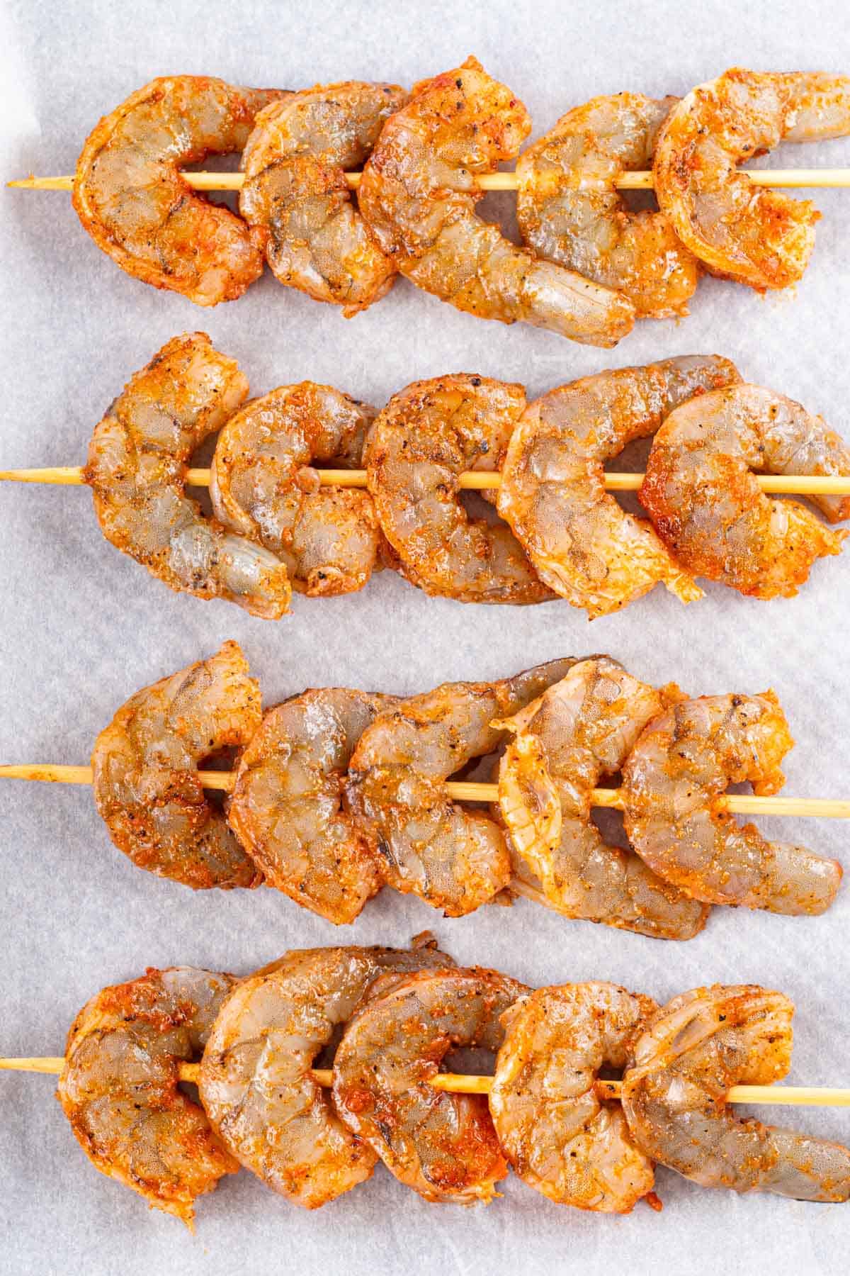 Skewering the shrimp, 5 per skewer.