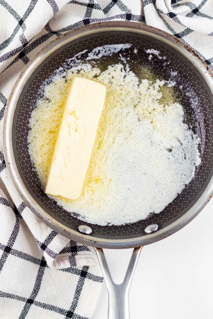 Melting butter in a pan.