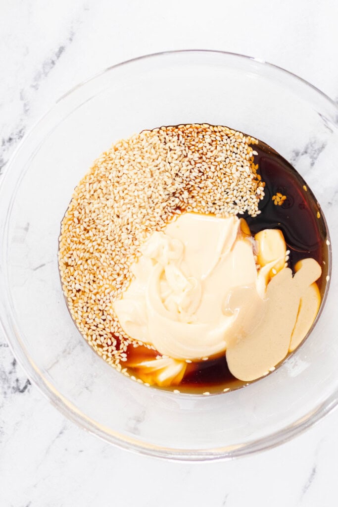 Adding all of the ingredients to a glass mixing bowl.