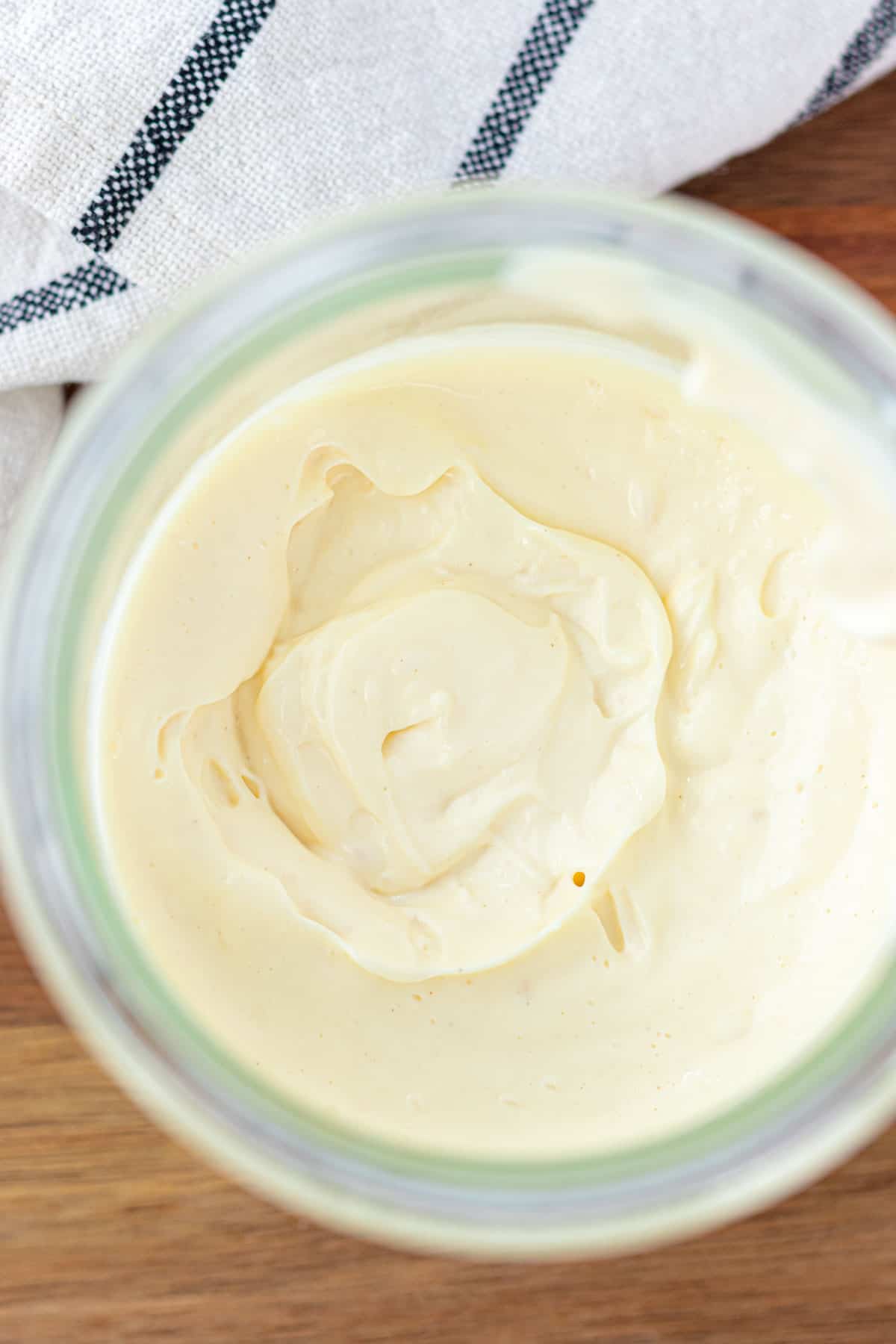 A jar full of thick avocado oil mayo.