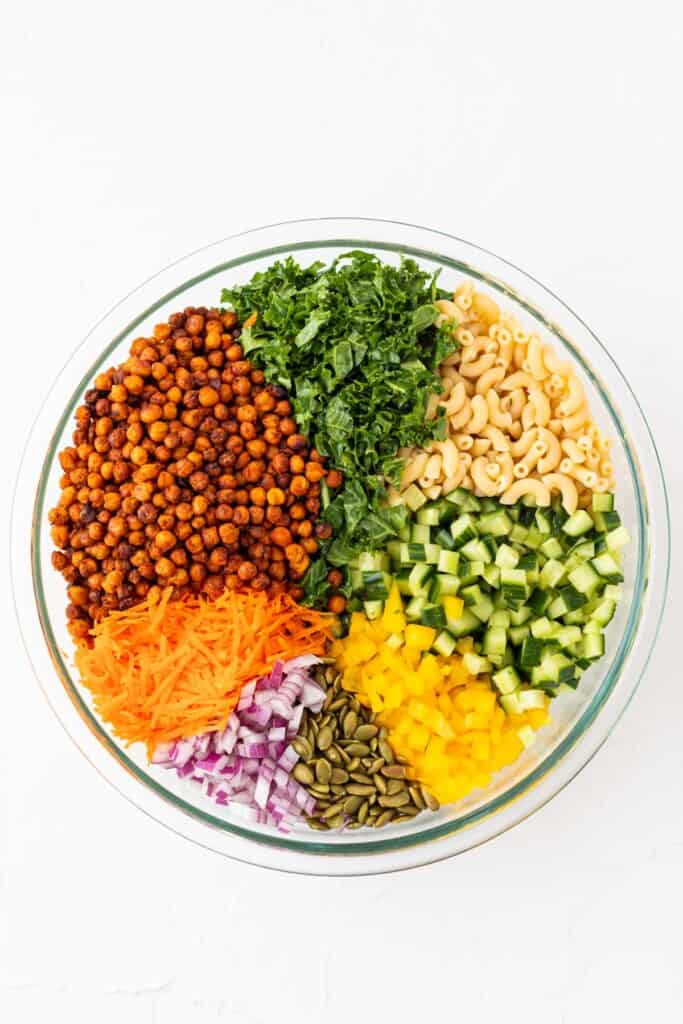 A mixing bowl full of all the ingredients in pie shaped sections.