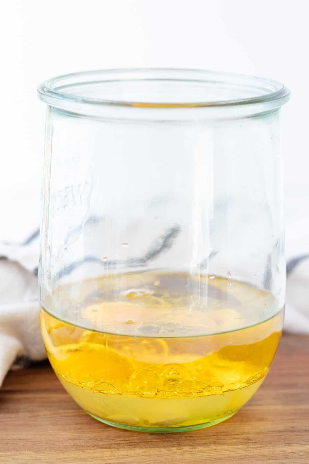 Adding all of the ingredients to a jar.