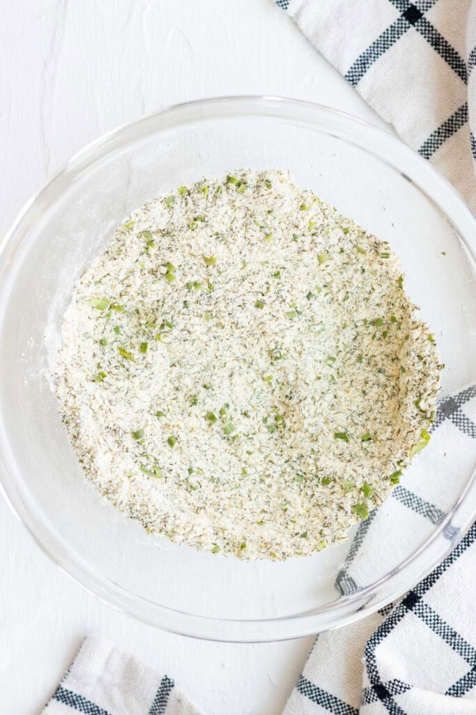 Ranch seasoning in a glass bowl mixed up.