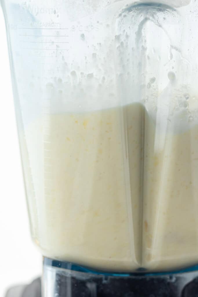 Blending piña coladas in a high speed blender.