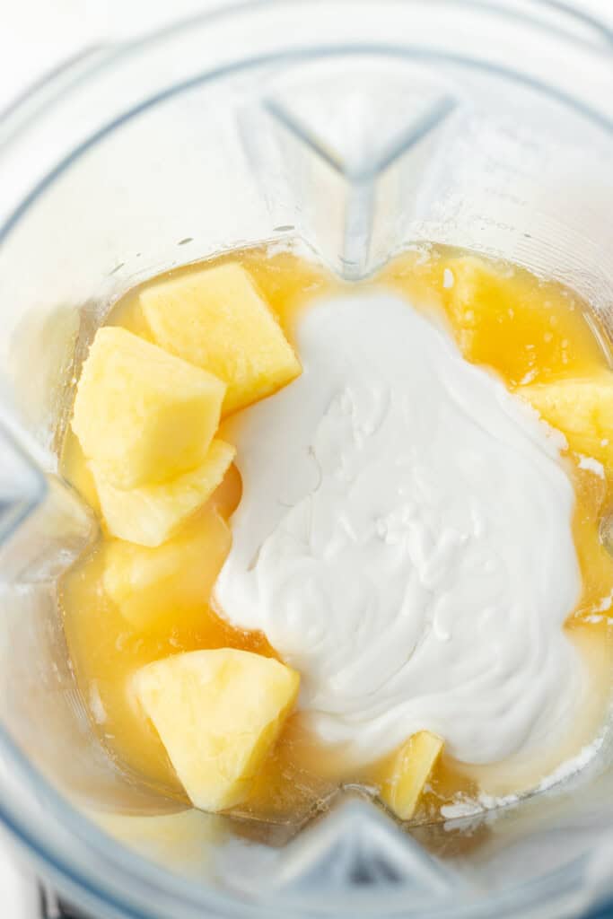 Adding all ingredients to the jar of a high speed blender.