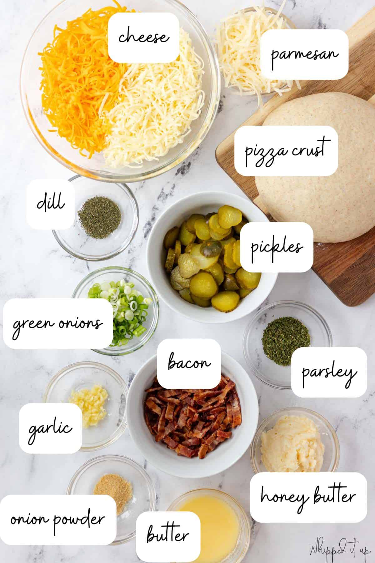 Ingredients include pizza crust, cheese, pickles, dill, green onions, bacon, honey butter, parsley, butter, onion powder, and garlic.