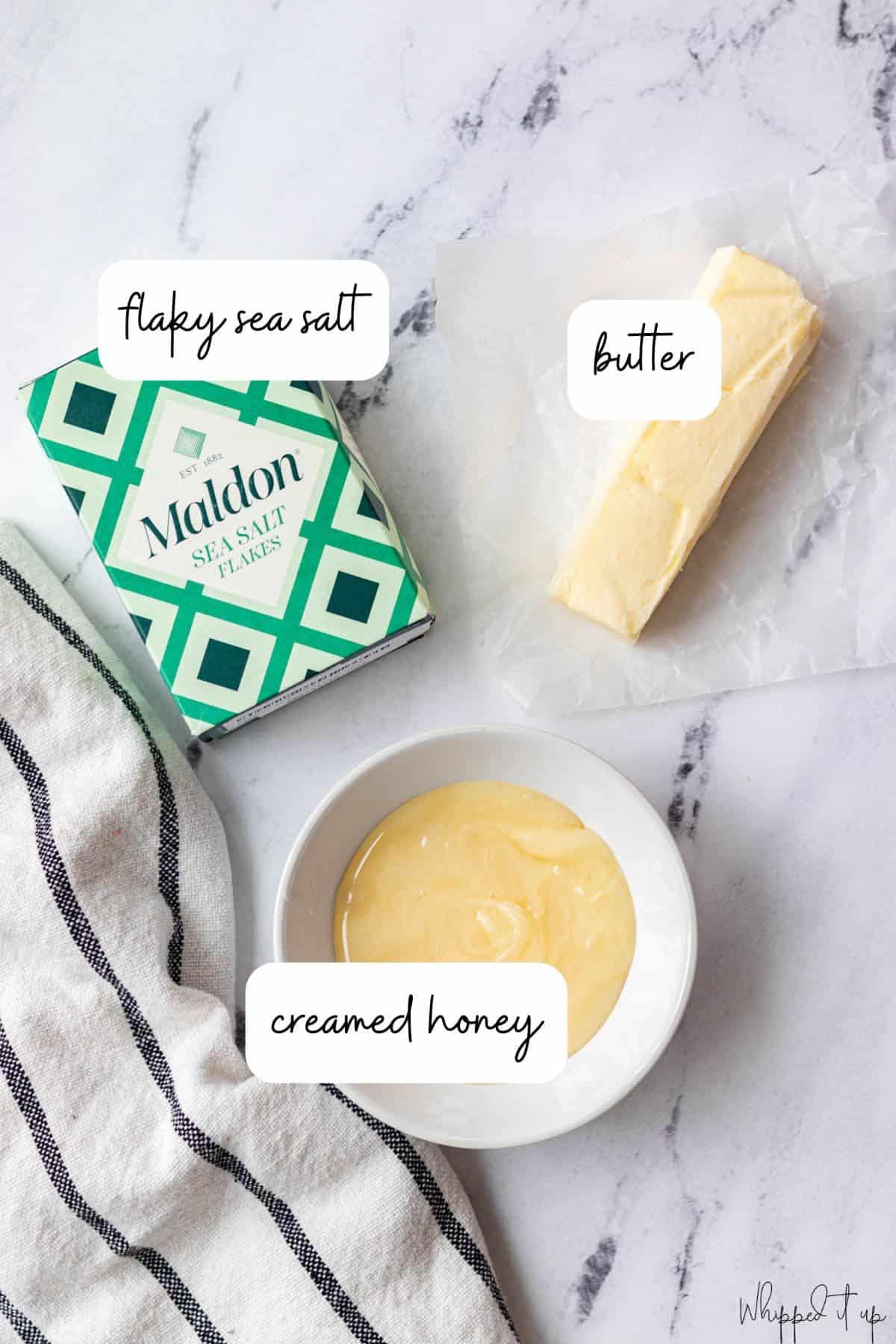 Ingredients to make honey butter include butter, creamed honey, and flaky sea salt.