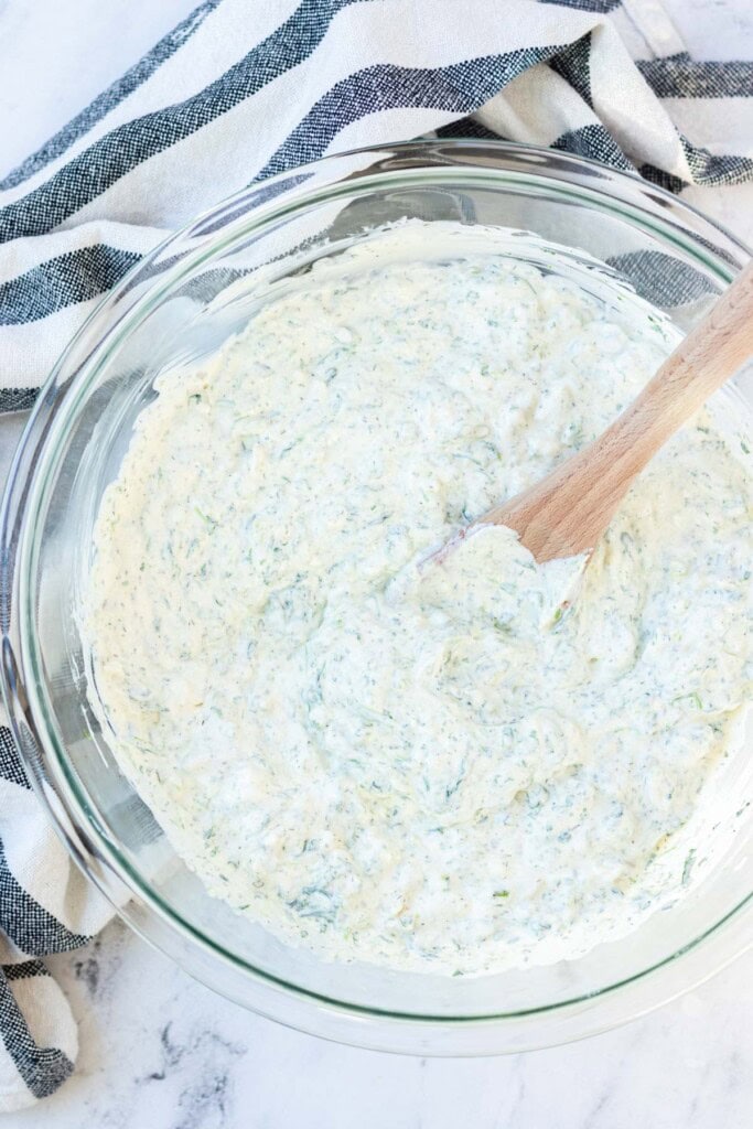 Stirring all of the ingredients together.