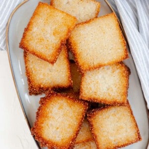 A blue plate fill of crispy rice squares.