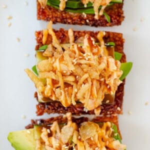 Three dynamite shrimp crispy rice squares layered with avocado and topped with crispy onions, eel sauce, and spicy mayo.