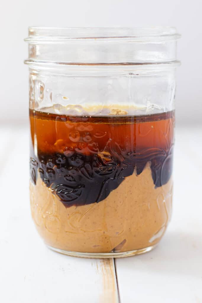 All of the ingredients layered in a clear mason jar.